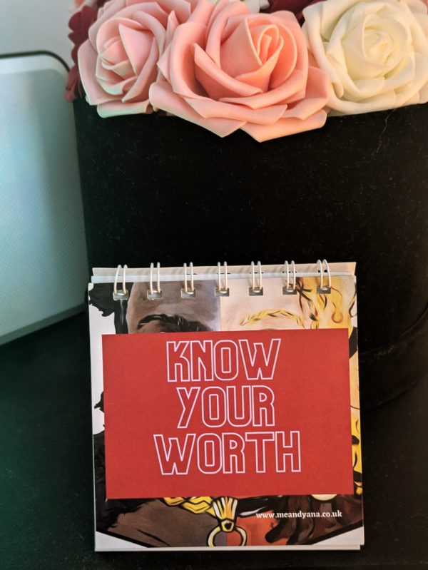 know your worth flip-book cover against a round box of flowers